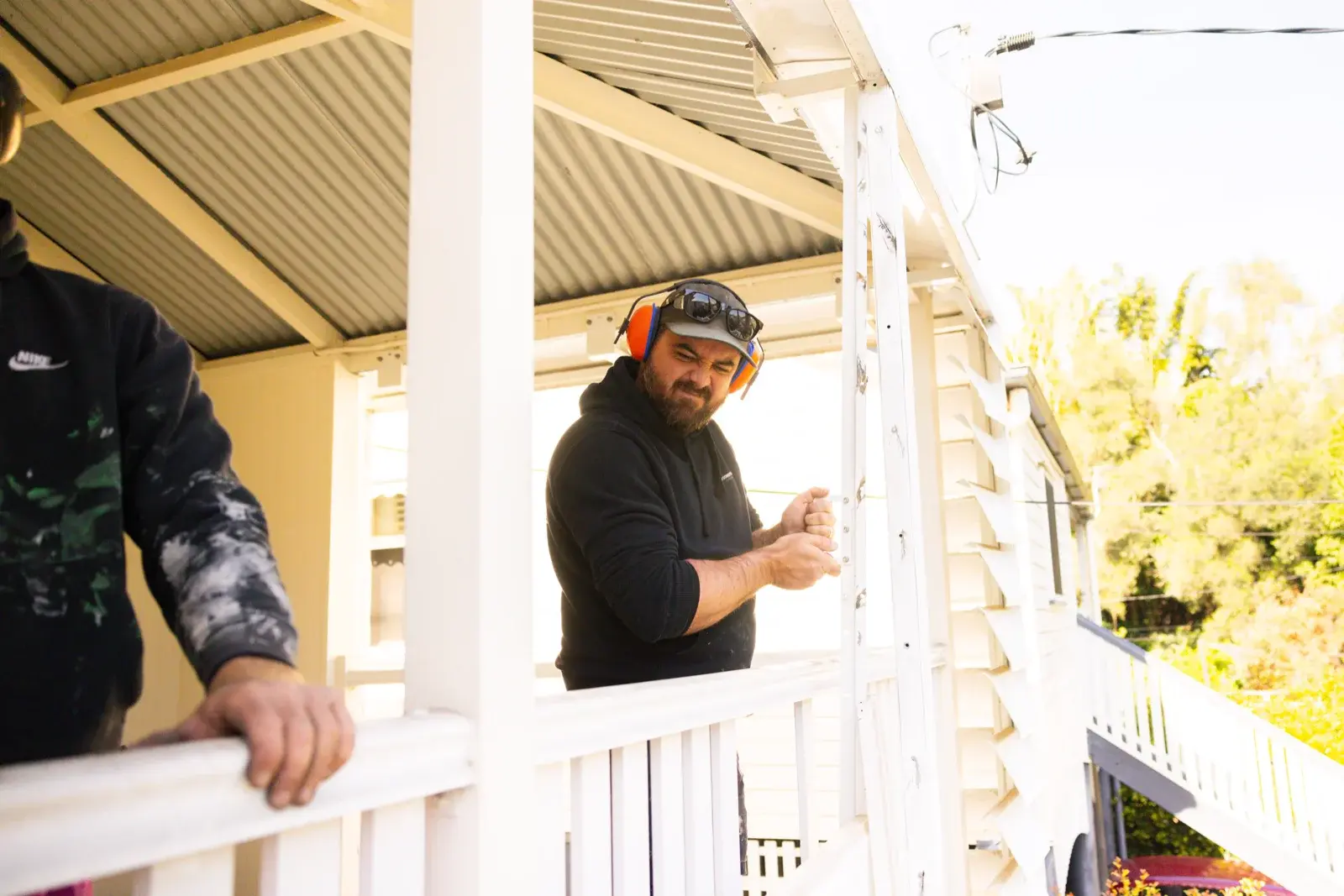 Farr Constructions carpenter working on Queenslander verandah renovation in Brisbane