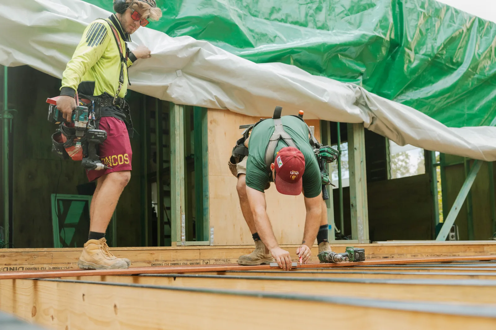 Framing crew on roof deck during Brisbane house extension lock-up stage