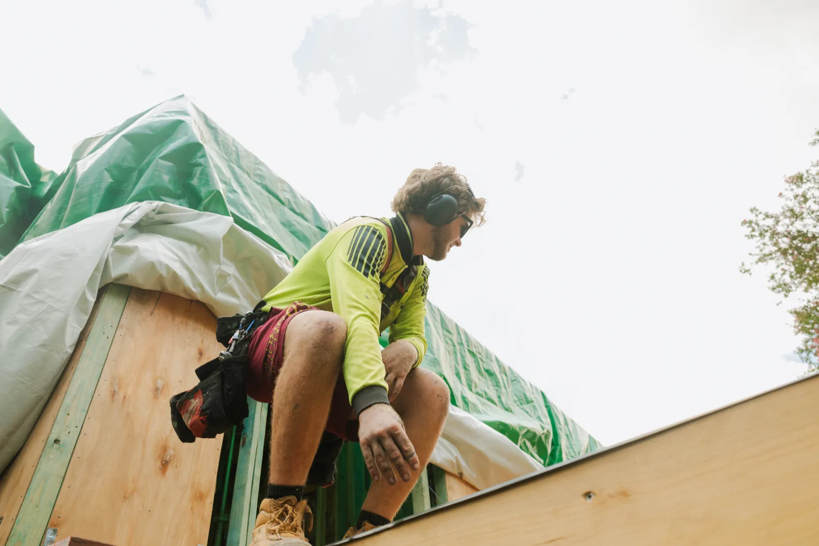 Tradesman working at roof level on Brisbane house extension