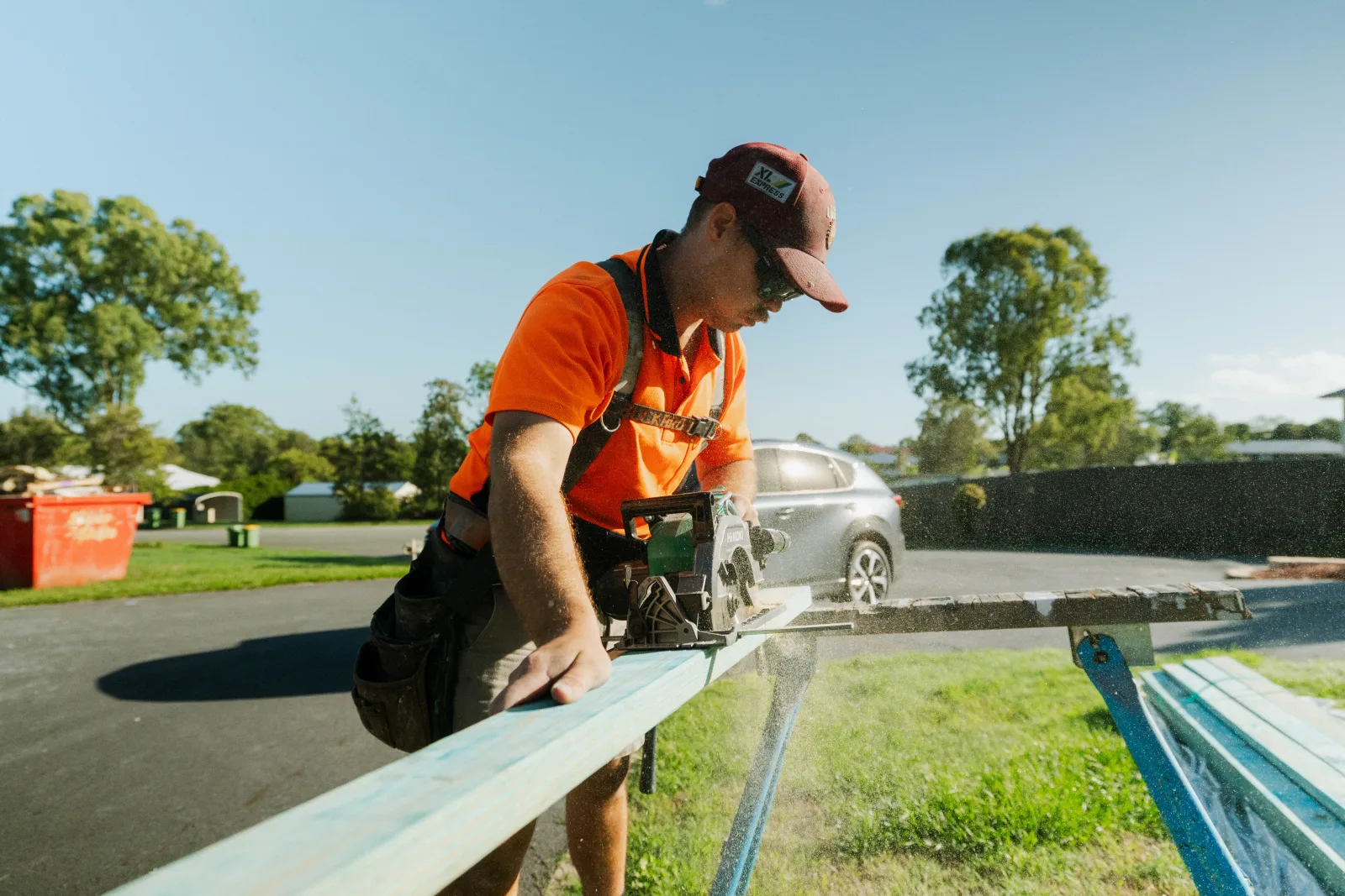 Carpenter using circular saw on new home build Brisbane
