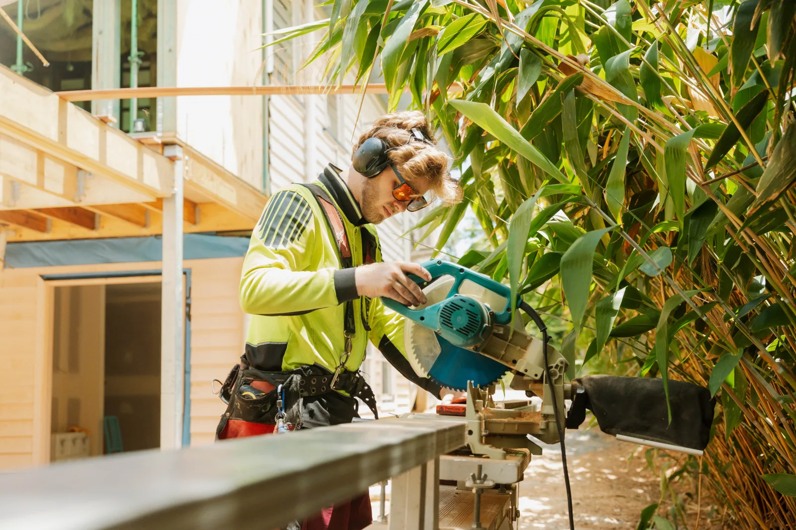 Carpenter using mitre saw on new build Brisbane