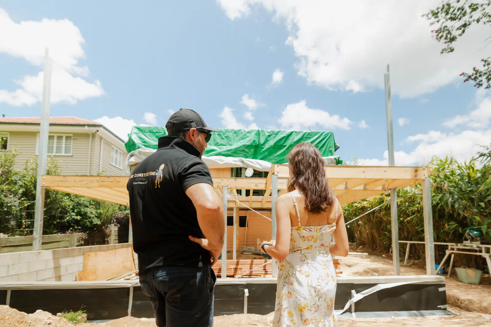 Tomas Farr walking a client through a house extension build site, Brisbane