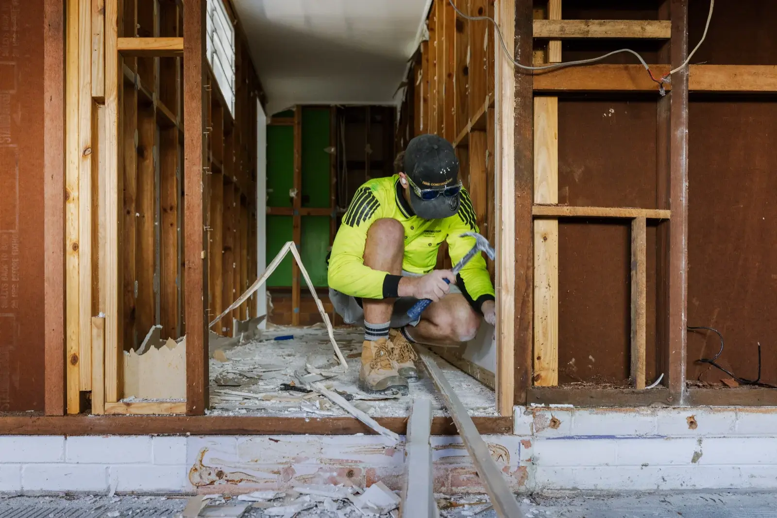 Farr Constructions tradesman working through lower-level demolition at Tarragindi renovation site, Brisbane