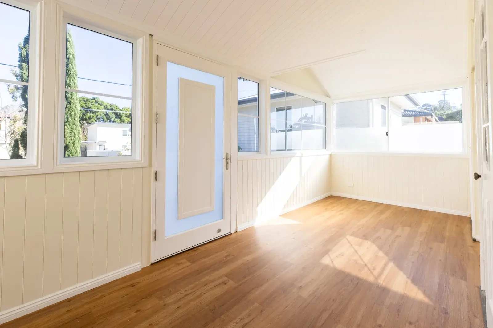 Finished Queenslander study room — bright VJ sheeting walls and vinyl plank flooring after conversion by Farr Constructions