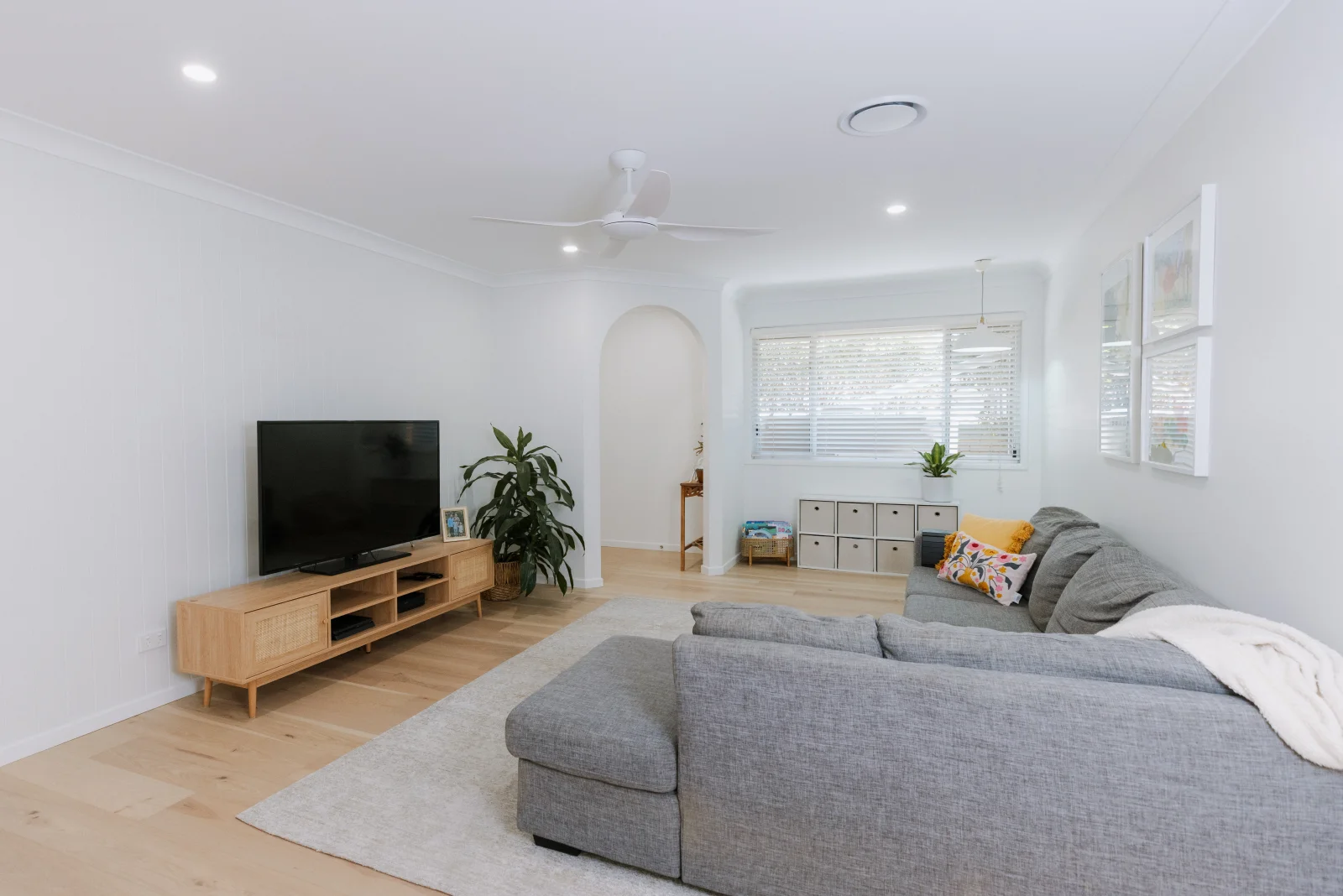 Completed living room renovation by Farr Constructions — bright open-plan interior with timber floors, Brisbane
