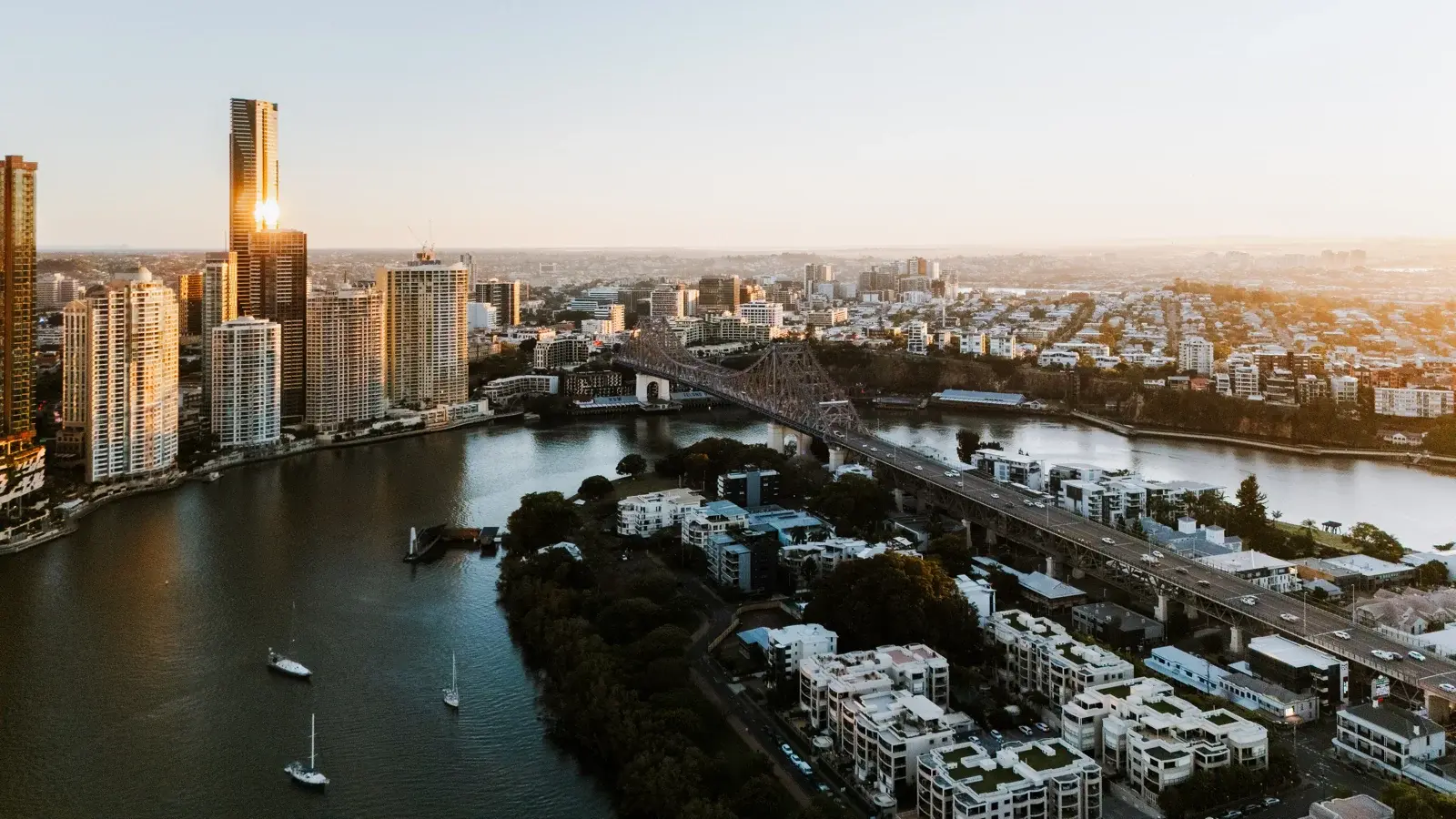 Aerial view of South Brisbane showing Story Bridge and Brisbane River at golden hour